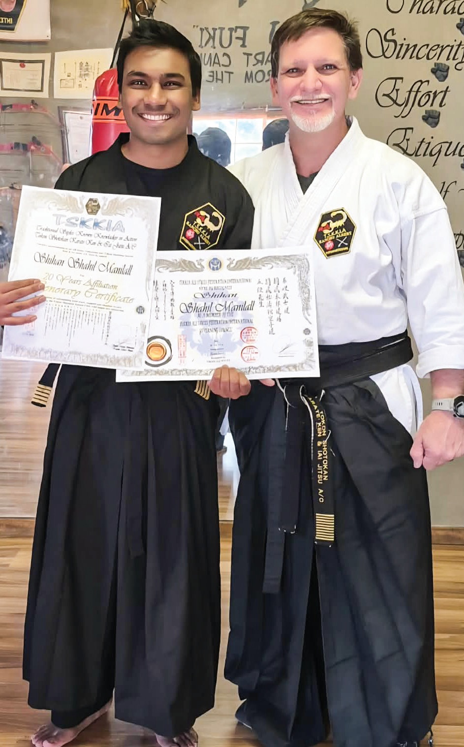 Two decades of dedication: shihan Shahil Manilall received his 20-Year Affiliation Award alongside proud kancho Albert Venter.